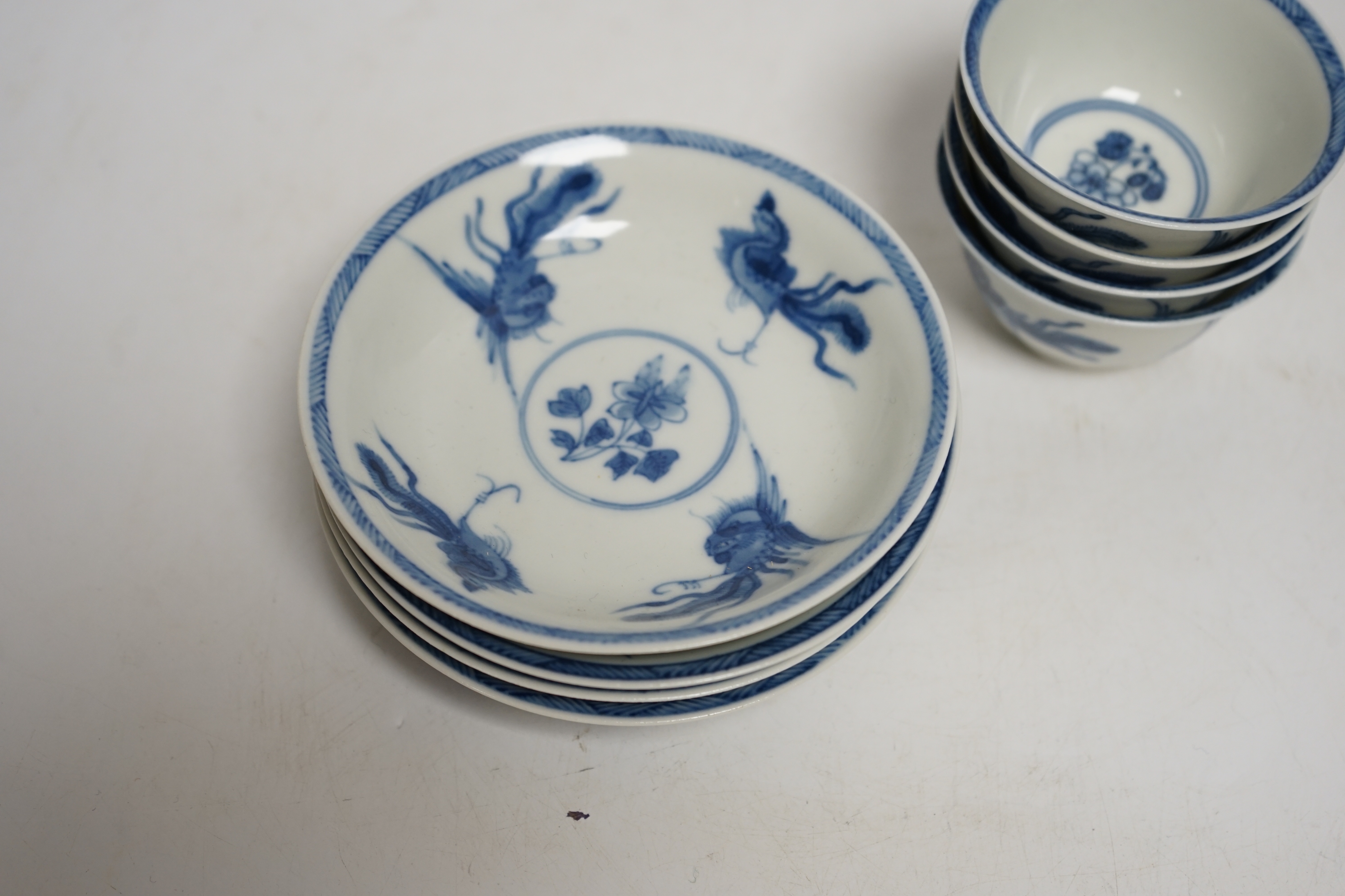 A set of four Chinese blue and white teabowls and saucers